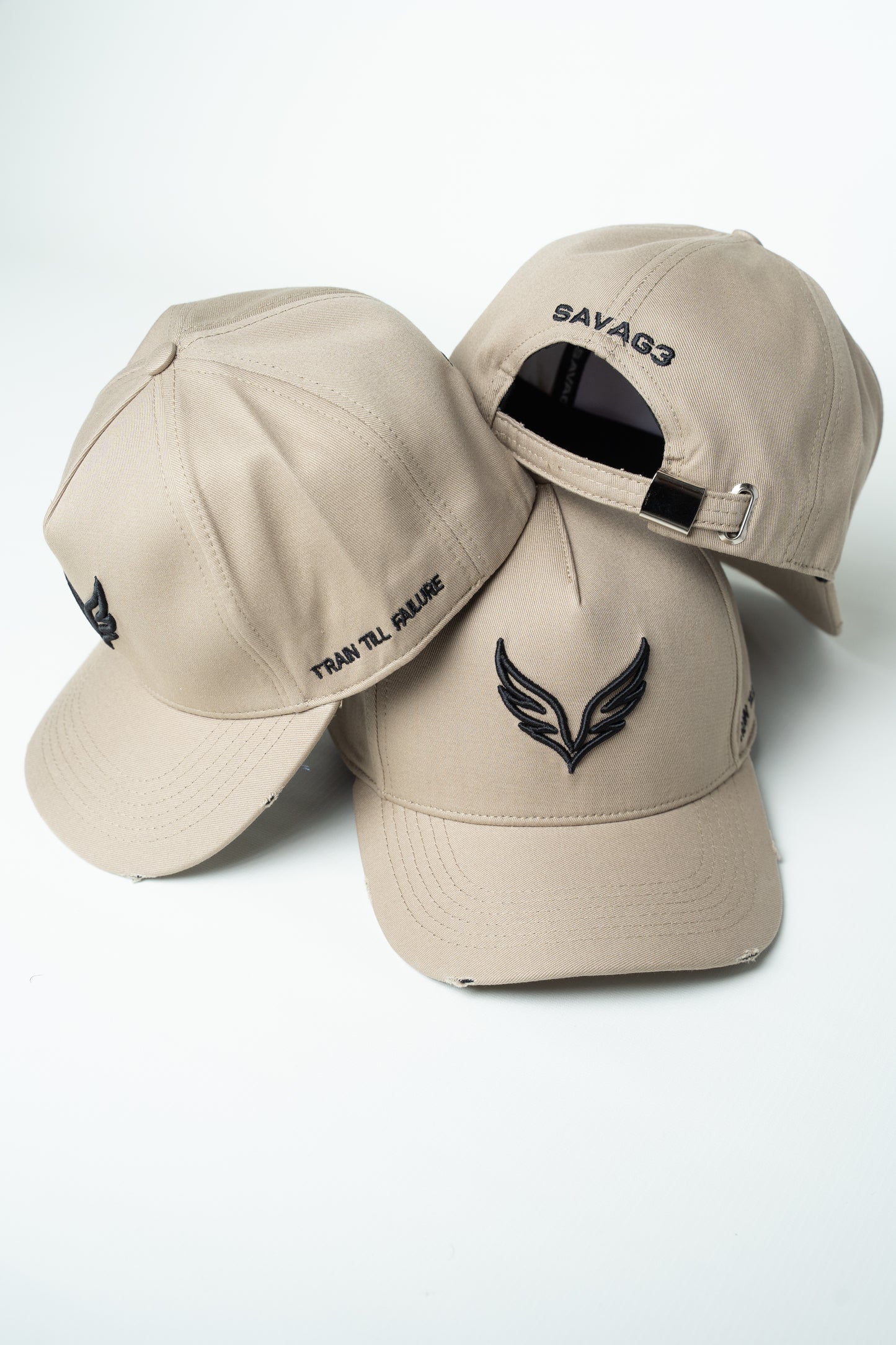 Side view of the SAVAG3 Vintage Cotton Cap featuring the embroidered "Train Till Failure" slogan and adjustable fit.
