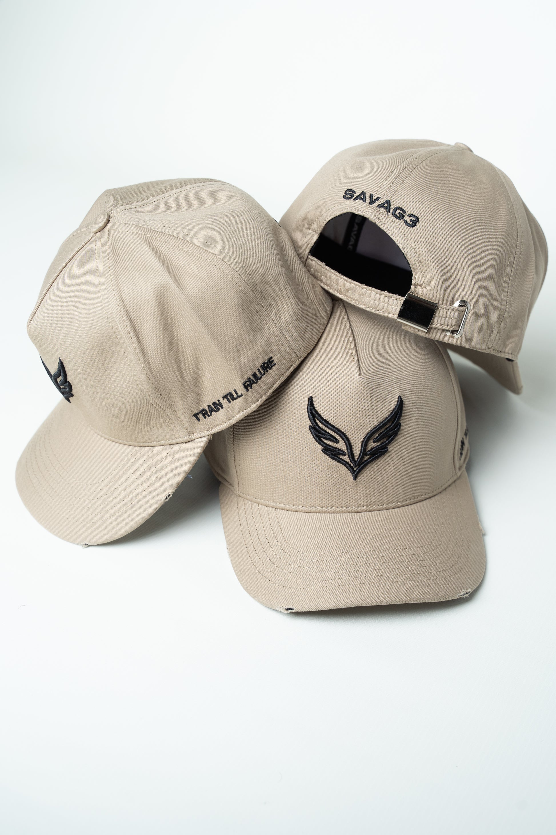 Side view of the SAVAG3 Vintage Cotton Cap featuring the embroidered "Train Till Failure" slogan and adjustable fit.
