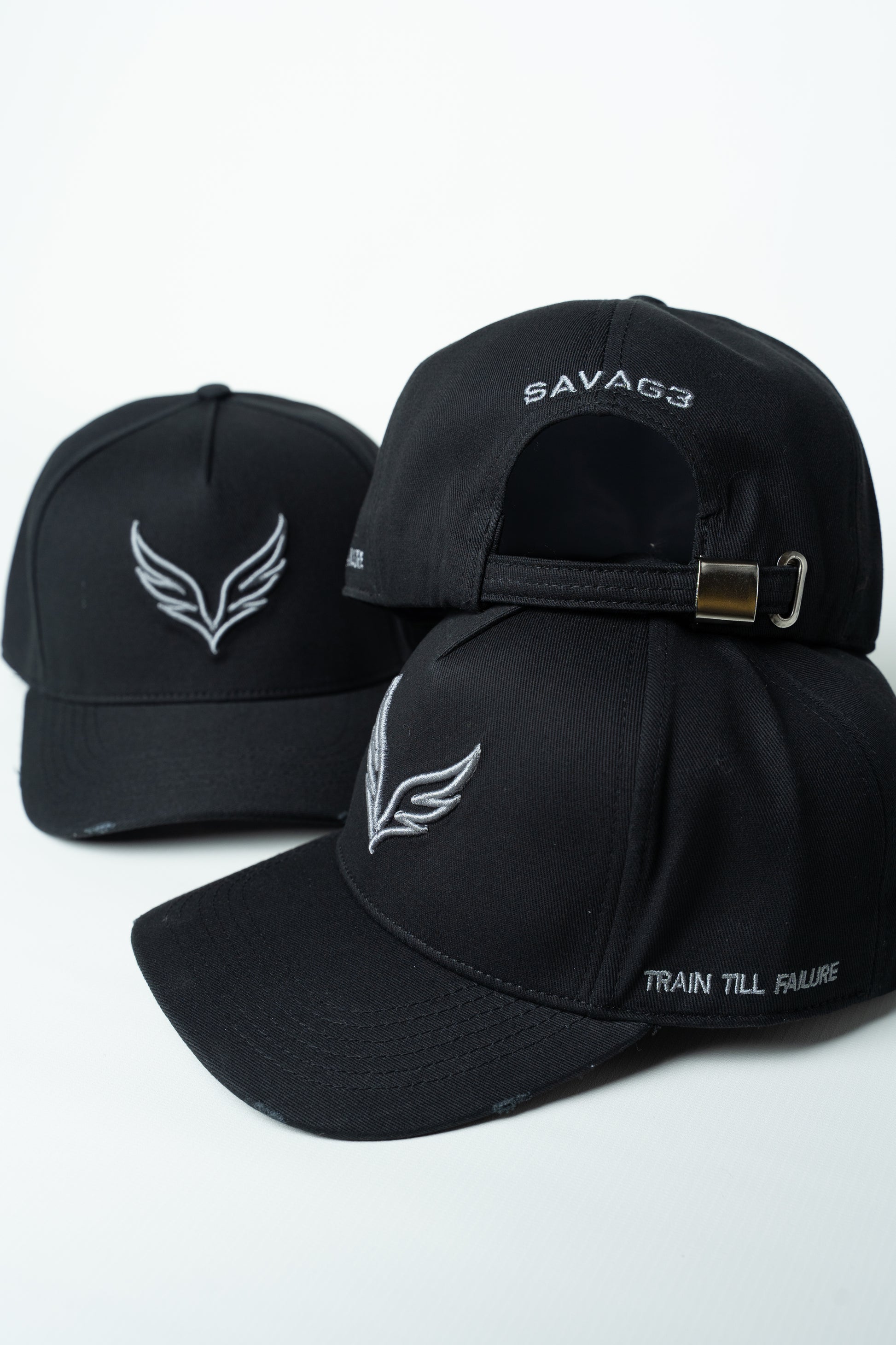 Side view of the SAVAG3 Vintage Cotton Cap featuring the embroidered "Train Till Failure" slogan and adjustable fit.